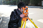 Land surveyor looking through transit courtesy of Pixabay.com